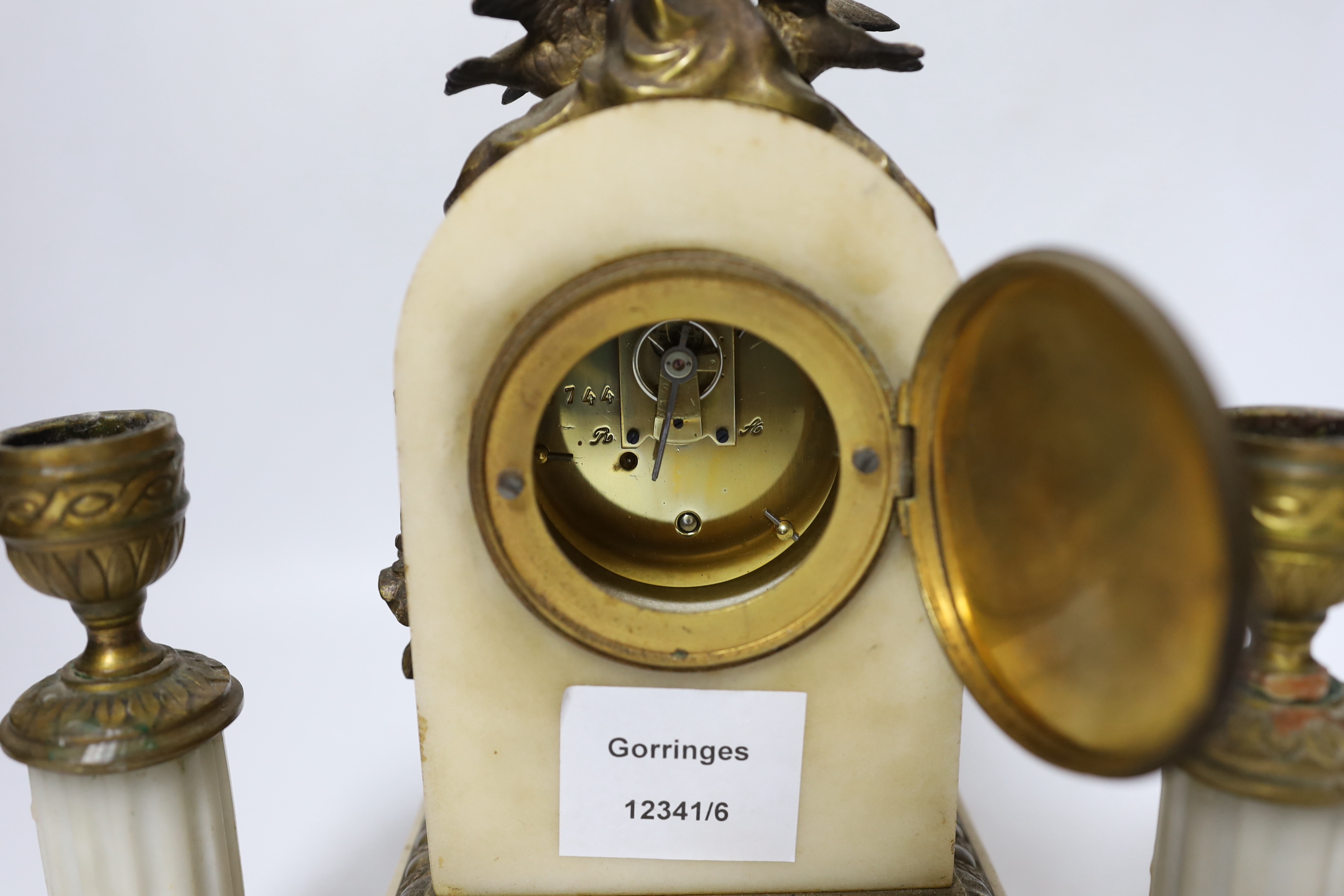 A French marble and ormolu clock garniture, early 20th century, clock 21cm high